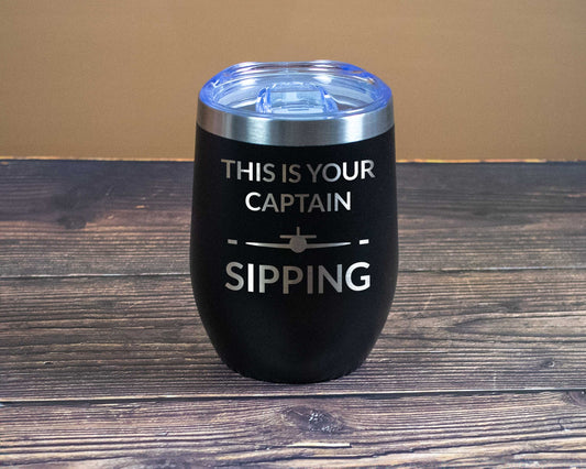 Captain sipping flying straight wine tumbler