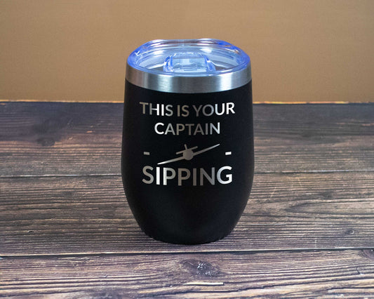Captain sipping in a turn wine tumbler