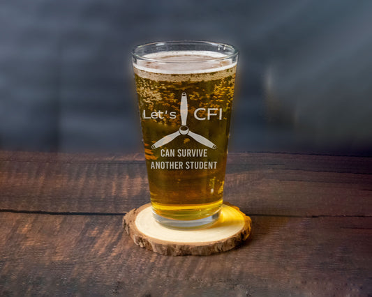 Pint glass engraved for the CFI with the saying Let's CFI can survive another student